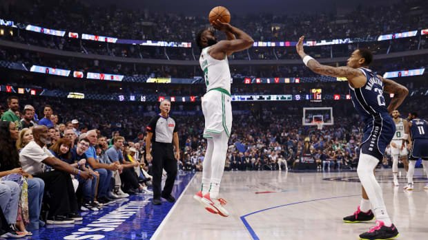 Jun 14, 2024; Dallas, Texas, USA; Boston Celtics guard Jaylen Brown (7) shoots the ball against Dallas Mavericks forward P.J. Washington (25) during the first quarter during game four of the 2024 NBA Finals at American Airlines Center. Mandatory Credit: Peter Casey-USA TODAY Sports